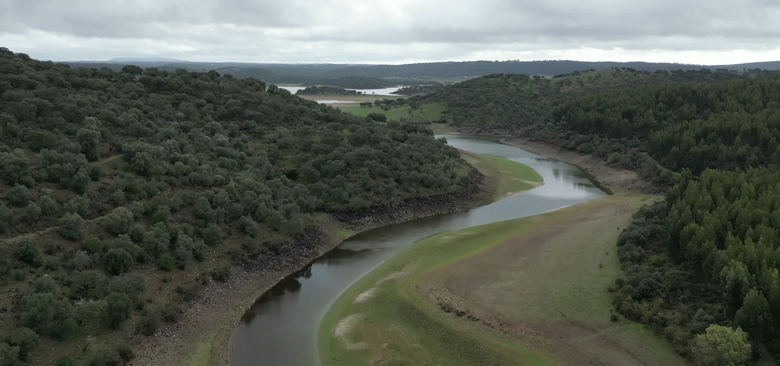 A winding waterway between wooded slopes in Portugal’s interior